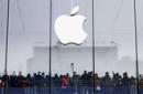Customers crowd for the opening of an Apple Store in Hangzhou